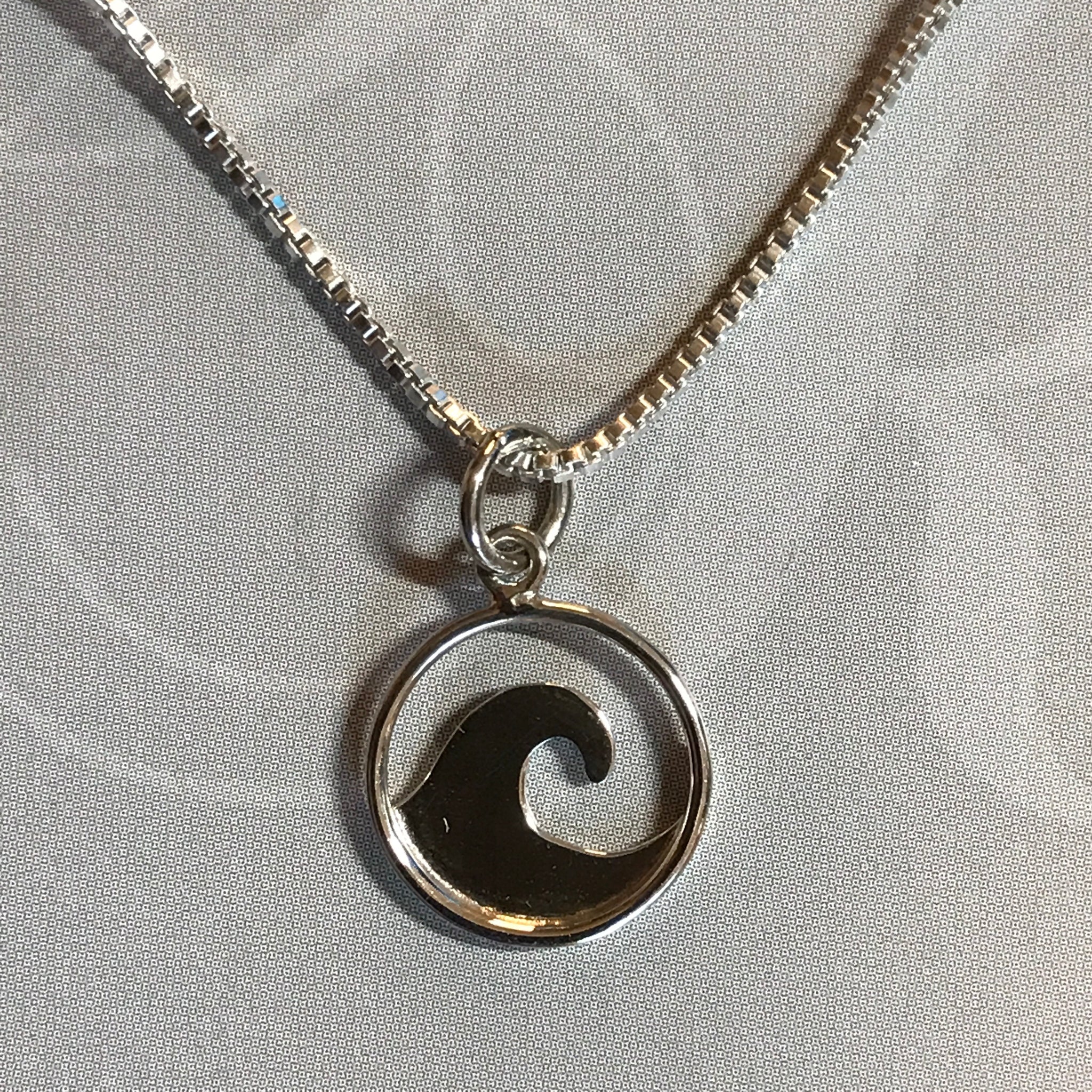 Sterling silver cutout wave pendant on sterling silver box chain necklace